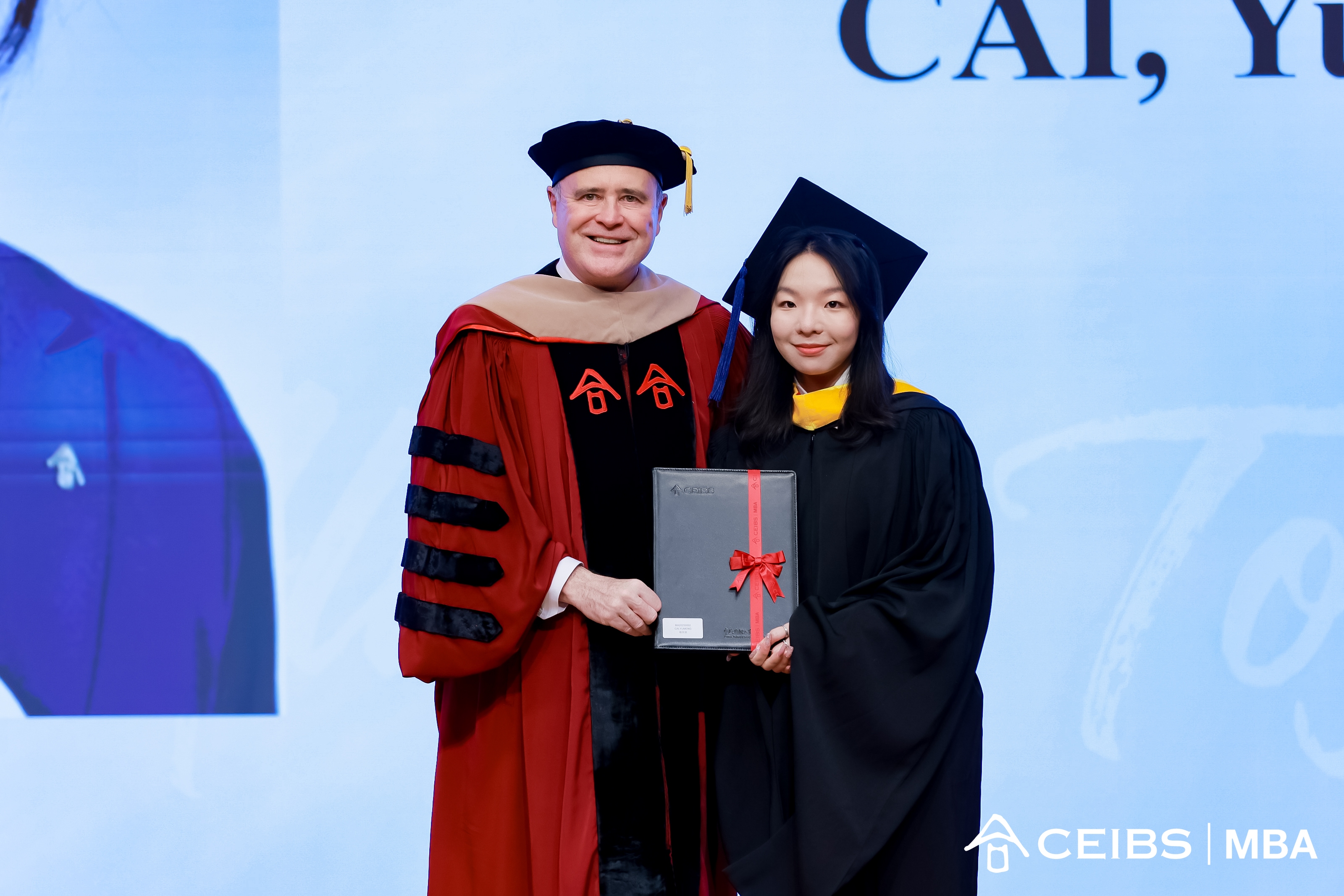 CEIBS Vice President and Dean Frank Bournois presents the graduation certificates to the graduates